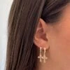 SMALL CROSS HUGGIE HOOPS -ALV Jewelry Shop image8 aa80ac49 4016 484e 8efd 3b9563b574f2